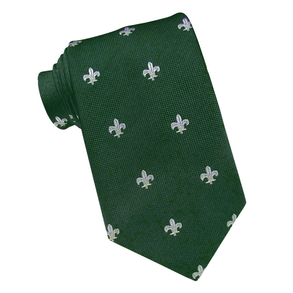 corbata confeccionada en color verde oscuro con diseño de flor de lis blancas